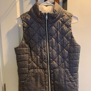 Small white and black puffer vest